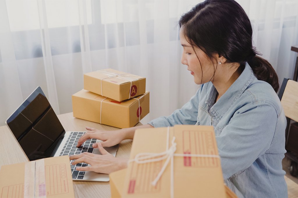 beautiful smart asian young entrepreneur business woman owner sme online checking product