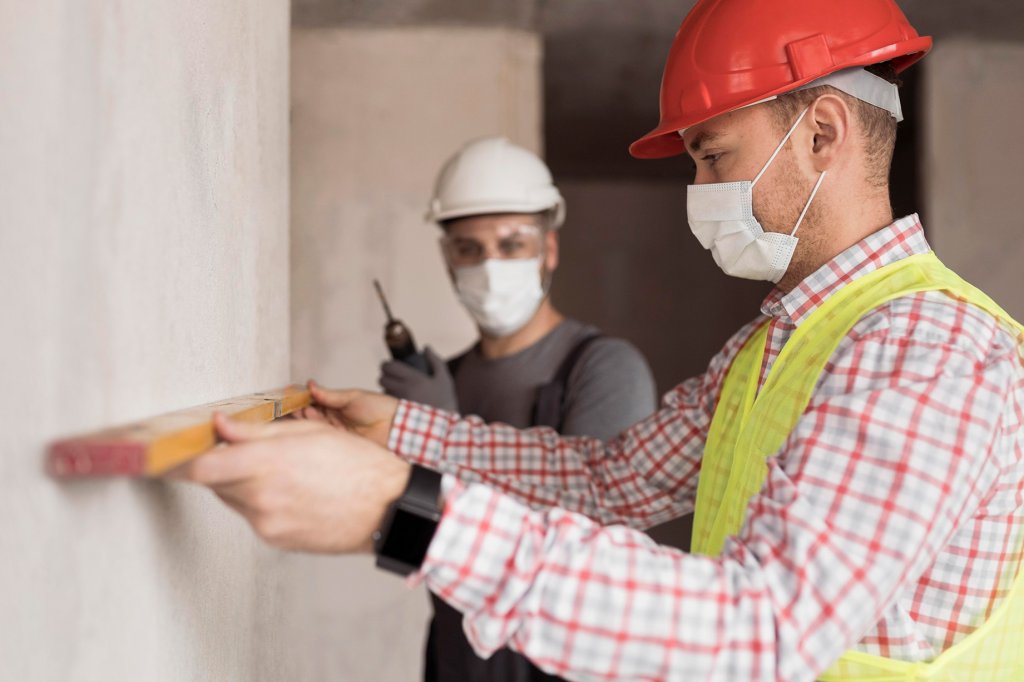 side view men working with masks