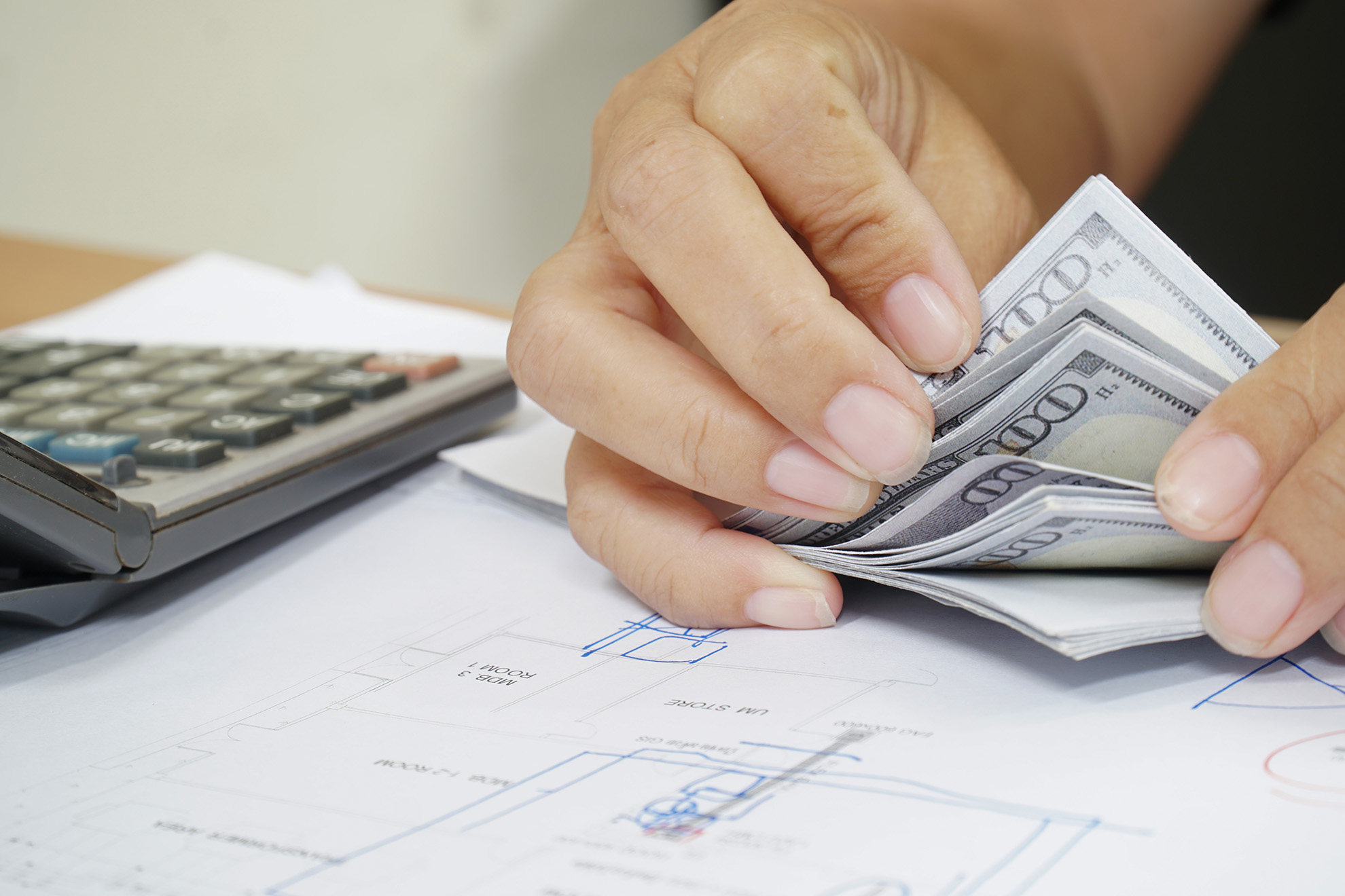women counting dollar bills finances accounts